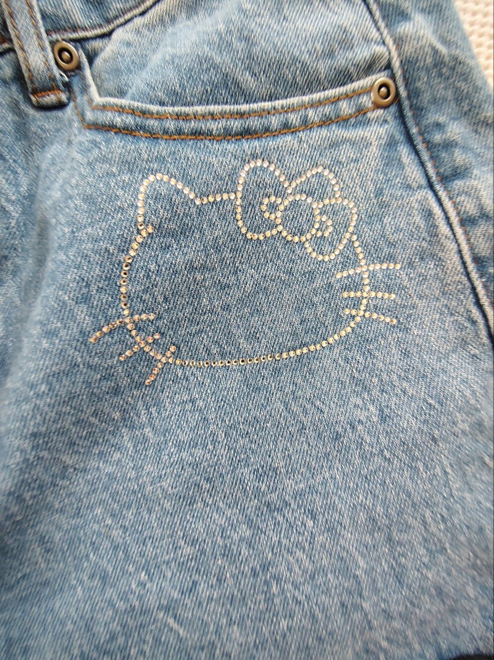 Hello Kitty Light Blue High-Rise Jeans with Red Bow Appliqués - Picture 7 of 15